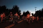 Participants ride into the night on Woodstock Boulevard with high energy. The route started at Mount Scott Park, traveled through Southeast Portland and ended at Sellwood Park.