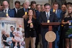 Speaker of the House Mike Johnson, R-La., joined at left by Rep. Lisa McClain, R-Mich., leads a memorial vigil to honor conservative activist Charlie Kirk who was shot and killed at an event in Utah last week, at the Capitol in Washington, Monday, Sept. 15, 2025.