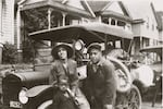 This image circa 1920-1925 shows Ruth Flowers, Ralph Flowers and Clifford Flowers with an automobile.