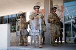National Guard stand guard near the metropolitan detention center Monday, June 9, 2025, in downtown Los Angeles. In California, the president called up the National Guard under a rarely-used law giving him the authority to quell “a rebellion.”