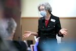Kathy Watson, director of health services at Friendsview Retirement Community in Newberg, Ore., talks with residents in the observation area during a COVID-19 vaccination clinic on Feb. 5, 2021. 