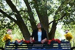Montoya stands behind a bench, on a trail near her home, in memory of Juliana.