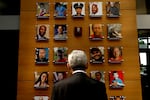 Attorney General Merrick Garland looks at an exhibit titled the Faces of Gun Violence while on a tour led by Steve Dettelbach, director of the Bureau of Alcohol, Tobacco, Firearms and Explosives, at ATF headquarters on April 23, 2024, in Washington, D.C. The display has now been taken down.