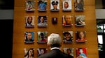 Attorney General Merrick Garland looks at an exhibit titled the Faces of Gun Violence while on a tour led by Steve Dettelbach, director of the Bureau of Alcohol, Tobacco, Firearms and Explosives, at ATF headquarters on April 23, 2024, in Washington, D.C. The display has now been taken down.