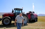 Republican Oregon state Rep. Mark Owens tours one of his company's hay fields in Harney County on Aug. 27, 2021.