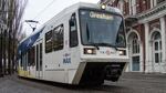 TriMet's MAX line passes through downtown Portland near the Skidmore Fountain.