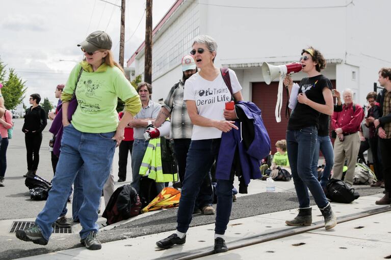 Protesters chant in opposition to oil trains running through the Northwest. The train derailment in Mosier, Oregon, added frustration to the demonstration in Vancouver.
