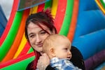 Calli holds her 1-year-old son at Siemers Farm in Mead, Wash., on a Saturday in October.