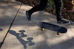 Caleb skates through a public park Monday, Nov. 11, 2019, in Oregon. He likes living in a small town, he said, because he gets around mostly on foot and by skateboard.