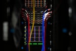 Cables are shown inside a server bank at the Sabey data center on Thursday, July 17, 2025, in Quincy, Washington.