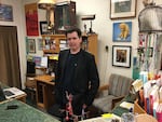 Bill Ham is a local actor in Ilwako, Washington, pictured here at his job at Time Enough Books.