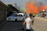 Sat., Oct. 7: Palestinians and militants from the Ezzedine al-Qassam Brigades run towards the Erez crossing between Israel and the northern Gaza Strip.