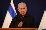 Israeli Prime Minister Benjamin Netanyahu speaks during a press conference in the Kirya military base in Tel Aviv on Oct. 28, amid ongoing battles between Israel and the Palestinian group Hamas.