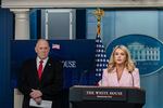 Press Secretary Karoline Leavitt (right) speaks as border czar Tom Homan looks on during a White House briefing on Monday.