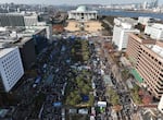 Participants gather during a rally to demand South Korean President Yoon Suk Yeol's impeachment outside the National Assembly in Seoul, South Korea, on Saturday.