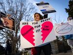 Penny Harrison and her son Parker Harrison rally outside the U.S. Capitol during the Senate Judiciary Committee's Ticketmaster hearing on Tuesday morning.