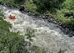 A raft from Noah’s River Adventures hitting the first small rapids after departing from Spring Island on the Upper Klamath River in June 2023.