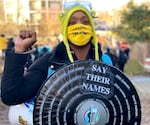 Racial justice activist Demetria Hester gathers with other protesters outside the Red House in North Portland on Tuesday, Dec. 8, 2020.