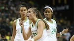 Oregon's Sabrina Ionescu, center, with Satou Sabally, left, and Ruthy Hebard, right, questions a call during the third quarter of an NCAA college basketball game against Arizona State in Eugene, Ore., Sunday, Feb. 9, 2020.