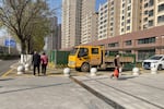 Outside the apartment complex where Lee Shin and his wife finally moved in after years of delay. Not long after Lee bought the unfinished apartment, construction stopped when the property developer allegedly lost money in other investments.