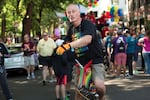 A man rides a unicorn-topped unicycle during the Portland Pride Parade Sunday, June 19, 2016.