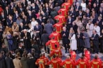 Firefighters, rescuers and builders involved in the restoration of Notre-Dame Cathedral parade during a ceremony to mark the re-opening of landmark cathedral, in central Paris, on December 7, 2024. Around 50 heads of state and government are expected in the French capital to attend the ceremony marking the rebuilding of the Gothic masterpiece five years after the 2019 fire which ravaged the world heritage landmark and toppled its spire. Some 250 companies and hundreds of experts were part of the five-year restoration project at a cost of hundreds of millions of euros. (Photo by Ludovic MARIN / POOL / AFP) (Photo by LUDOVIC MARIN/POOL/AFP via Getty Images)