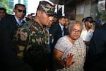 Prime minister of Nepal's interim government, Sushila Karki (front right), arrives at the National Trauma Center hospital to visit victims injured in clashes with security personnel, in Kathmandu, on Sept. 13. Nepal's capital on September 13, took a step back towards normality after deadly anti-corruption protests, as daily life returned with a curfew eased and an interim prime minister sworn into office. (Photo by Arun SANKAR / AFP) (Photo by ARUN SANKAR/AFP via Getty Images)