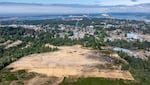 In this undated photo provided by Timber Cove developer Greg Drobot a drone aerial image shows the land of the planned 400 home subdivision on the west side of Coos Bay, Ore.