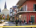 People stand on street looking for evidence,