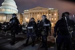 Authorities remove protesters from the U.S. Capitol, Wednesday, Jan. 6, 2021, in Washington.