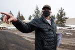 Bend Heroes Foundation chair Dick Tobiason tours the site of the future Central Oregon Veterans Village in Bend, Ore., Thursday, Feb. 18, 2021. The village will provide housing and services to 15 veterans transitioning out of homelessness.