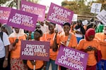 The debate over FGM has divided The Gambia for months, with hundreds gathering to protest outside parliament. Here, anti-FGM protestors demonstrate at the National Assembly session on March 18.