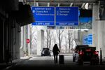 An airline passenger walks to her ride share vehicle after arriving at Chicago's Midway Airport just days before a major winter storm Tuesday, Dec. 20, 2022, in Chicago.