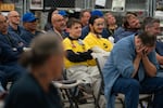 College students and adults in custody look on, as an Oregon State Penitentiary team competes against students from local colleges, on Monday, Oct. 13.