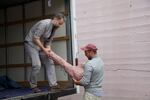 Unloading Heidi Schwegler's work at the Hazen Hardware Building in Clatskanie.