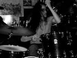 Lauren K. Newman doing what she does best, thrashing on the drums. 