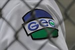 A patch is shown on the uniform of a guard with the GEO Group, Inc., during a media tour of the U.S. Immigration and Customs Enforcement detention center, Monday, Dec. 16, 2019, in Tacoma, Wash. The GEO Group is the private company that operates the center for the U.S. Government.