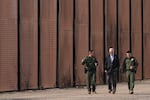 FILE - President Joe Biden walks with U.S. Border Patrol agents along a stretch of the U.S.-Mexico border in El Paso Texas, Jan. 8, 2023. (AP Photo/Andrew Harnik, File)