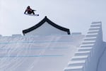 United States' Sean FitzSimons, a snowboarder, is seen midair as he competes during the men's slopestyle finals at the 2022 Winter Olympics, Monday, Feb. 7, 2022, in Zhangjiakou, China.