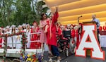 Luke Hogan Laurenson at his graduation from Ashland High School in June 2023. He was a valedictorian and delivered a speech using a communication device, one of the tools he uses to overcome the challenges he faces from dystonic quadriplegia cerebral palsy.