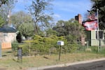 Flags outside one Prineville home combine references to the 2nd Amendment, the Confederate battle flag and political support for former President Donald Trump, as the home next door is for sale. May 17, 2021.