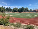 The Grant High School football field in Northeast Portland, photographed on Aug. 13, 2023, with the school visible in the background. Portland school and parks officials have announced that the field will not be used for organized sports this fall, because it failed inspections.