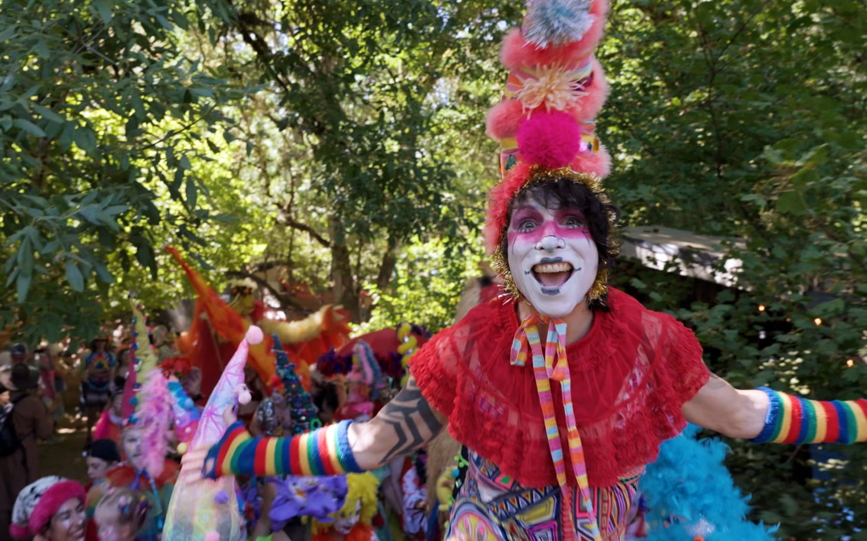 Sissily Seven Root, a member of the Risk of Change Clown Collective, entertains at the Oregon Country Fair, July 12, 2024.