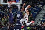 Portland Trail Blazers forward Deni Avdija (8) is fouled by New Orleans Pelicans forward Jeremiah Robinson-Earl (50) as he drives to the basket in the second half of an NBA basketball game in New Orleans, Wednesday, Jan. 8, 2025.