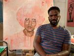 Jeremy Okai Davis in his SE Portland studio with the painting "Metering" from his show "Presence of Color."