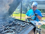 Yakama Nation member Evans Lewis grills lamprey.