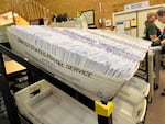 FILE - Ballot envelopes sit in the Thurston County elections center.