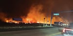 Fire and smoke fills the sky from wildfires near the Lahaina Bypass in Maui, Hawaii, on Tuesday.