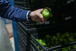 Tomatillos are among the fresh produce in refrigerated warehouses at the Sysco food distribution center in Houston.