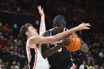 Oregon State forward Johan Munch (24) defends Gonzaga forward Graham Ike (15) during an NCAA college basketball game Saturday, Feb. 7, 2026, in Corvallis, Ore. (AP Photo/Mark Ylen)